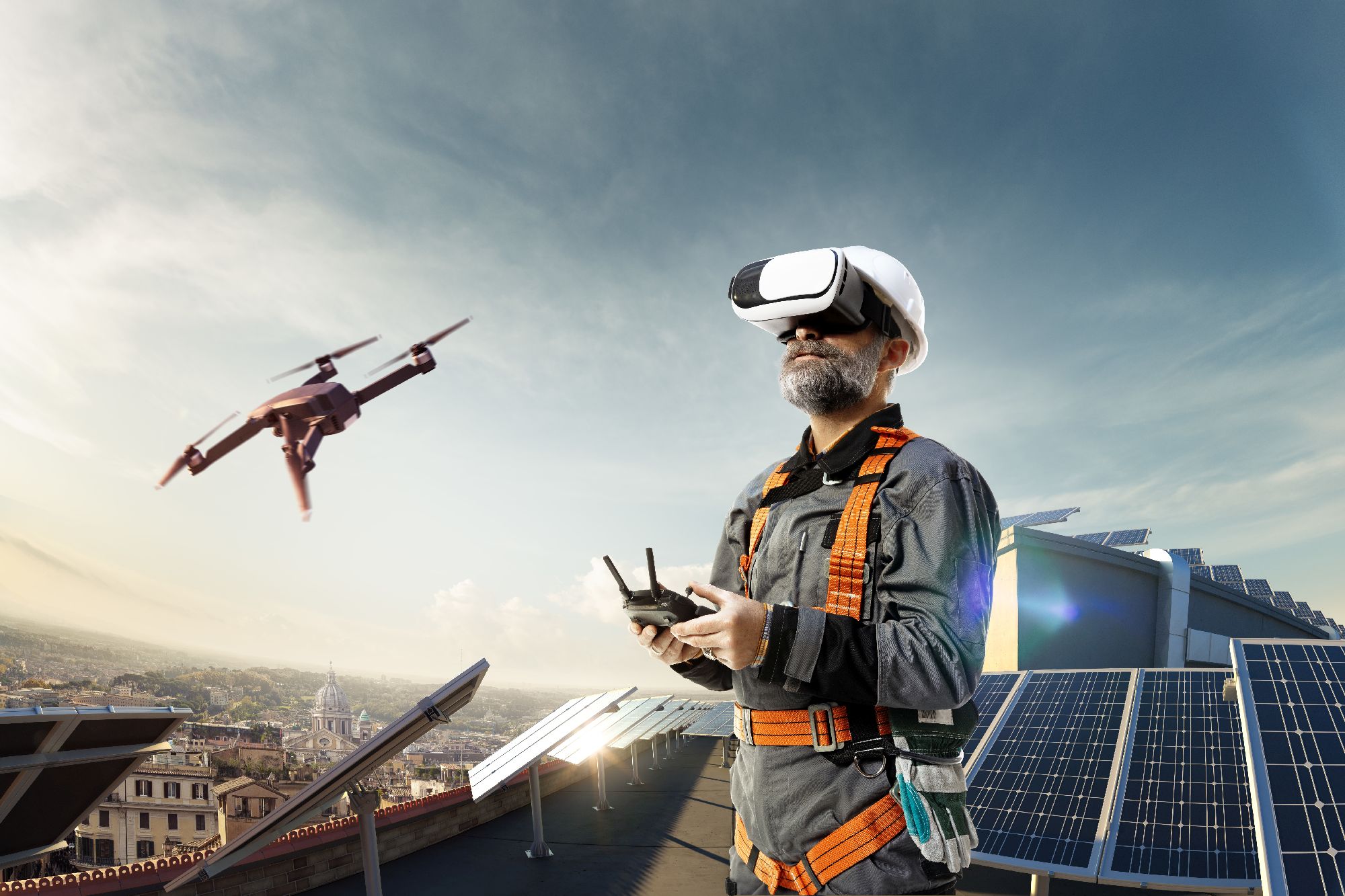A happy engineer using a drone and vr helmet for cheking solar station on city roof - Innovation