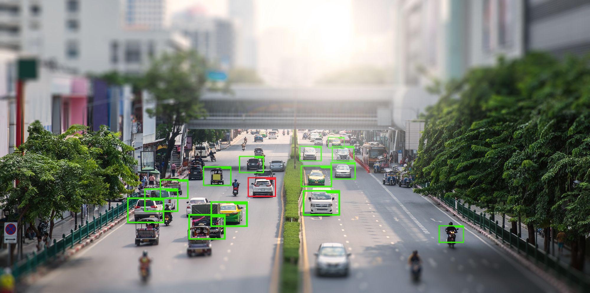 City roads with motorised vehicles that are being captured using smart CCTV technology to identify them