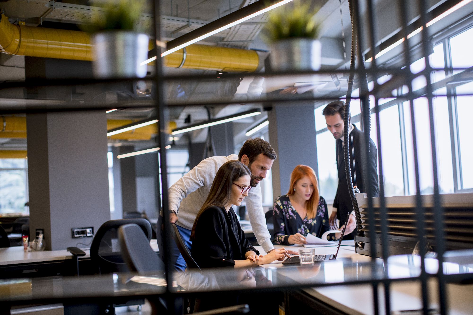 Business people collaborate in a modern office - Global City Futures - Professional Services