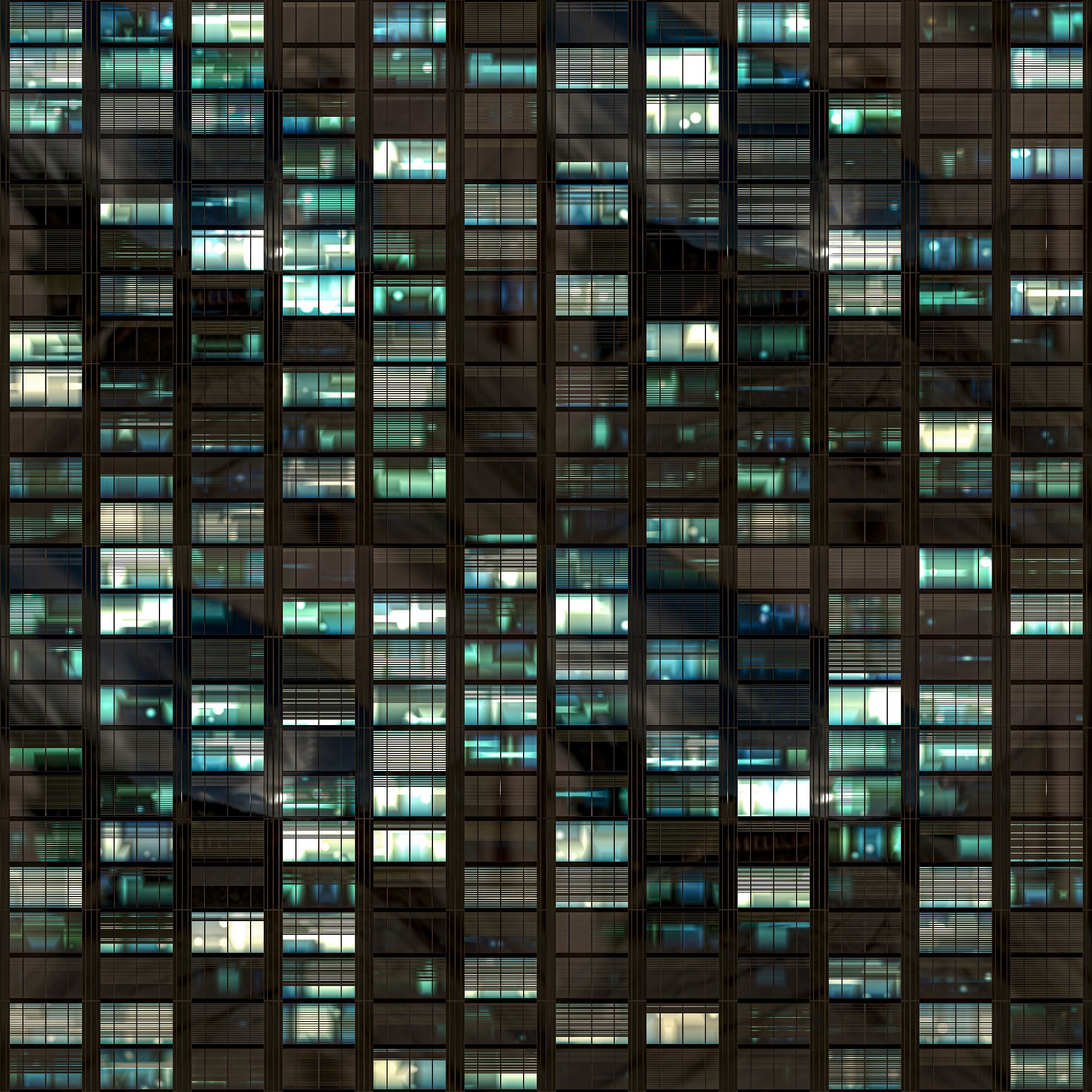 An office building facade at night with some windows illuminated and some not - Professional Services